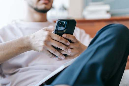 an electrician using a mobile app for invoicing