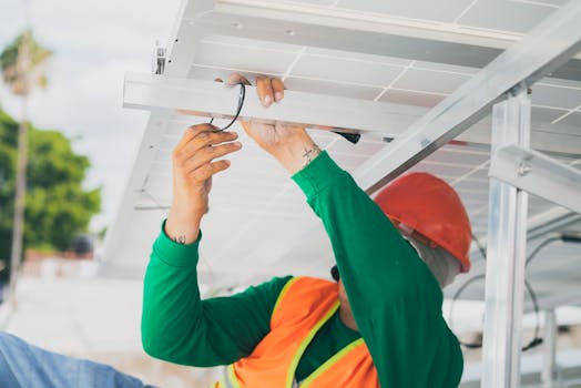 image of an electrician working on a solar panel installation