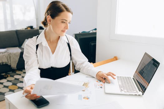 happy business owner reviewing financial reports